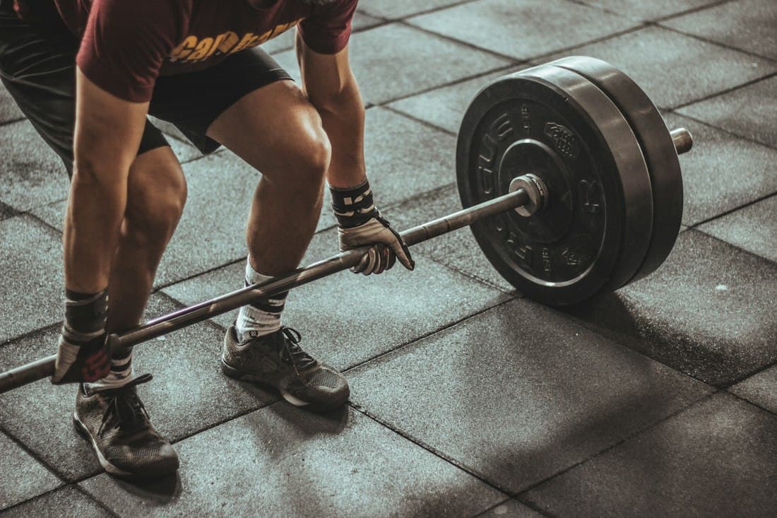 Close-up of a deadlift with chalked hands