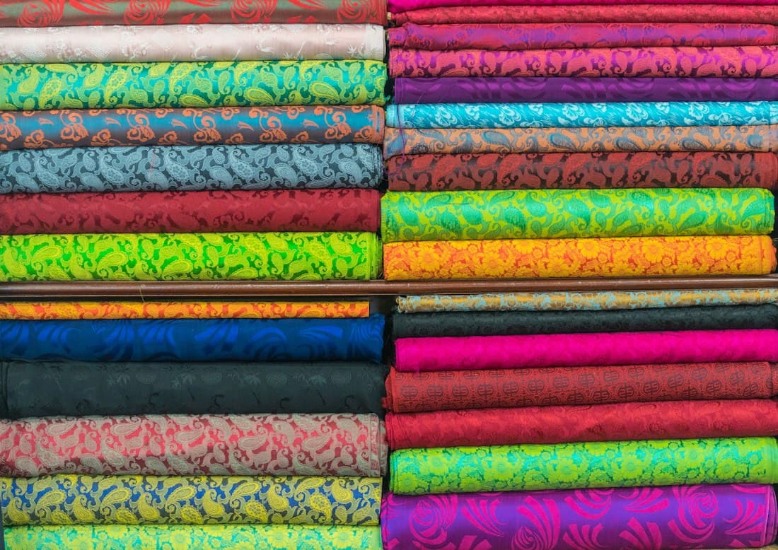 Stacks of colourful handloom fabric