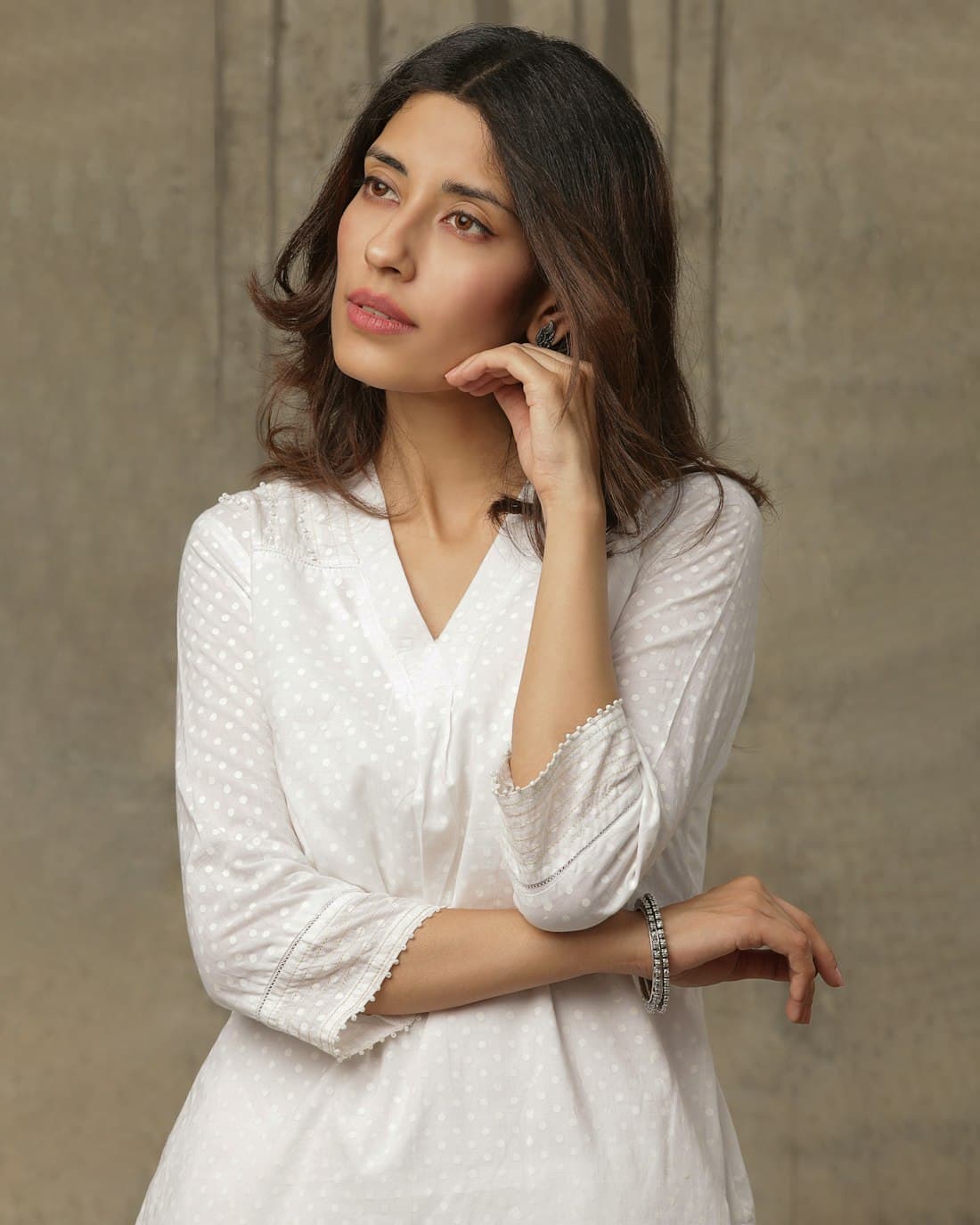 Woman in a white chikankari kurta